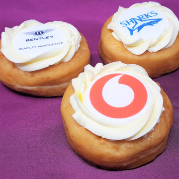 3 doughnuts with icing and company logo