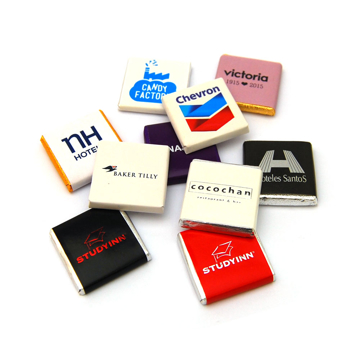 small individual chocolates wrapped in foil with a branded wrapper